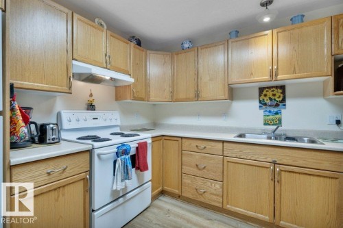 108 4806 48 Avenue, Leduc, AB - Indoor Photo Showing Kitchen With Double Sink