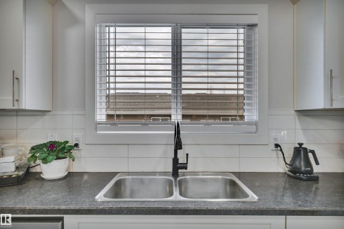 258 Robinson Drive, Leduc, AB - Indoor Photo Showing Kitchen With Double Sink