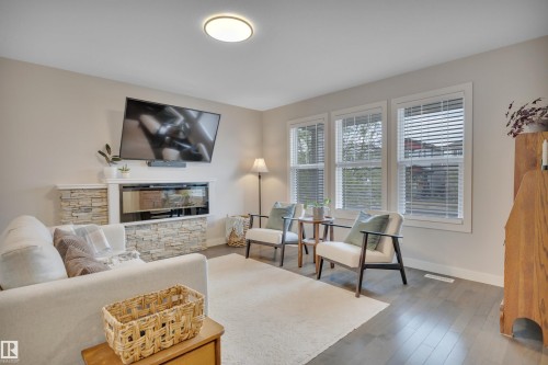258 Robinson Drive, Leduc, AB - Indoor Photo Showing Living Room With Fireplace
