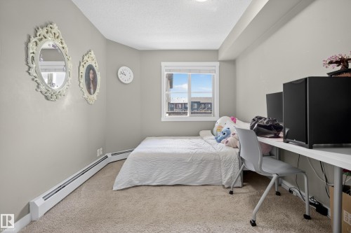 Carpeted room with a window providing exterior views - 314 3211 James Mowatt Trail Sw, Edmonton, AB - Indoor Photo Showing Bedroom
