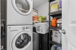 Dedicated utility space featuring a stacked washer and dryer unit - 