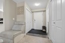 Entryway featuring a white solid-core door, tiled flooring, and a flush-mount ceiling light fixture - 314 3211 James Mowatt Trail Sw, Edmonton, AB  - Indoor Photo Showing Other Room 