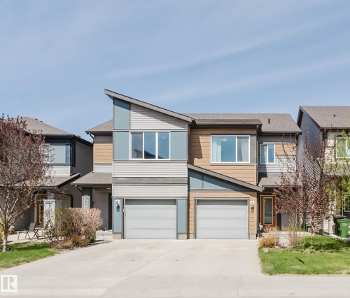 Contemporary townhome exterior featuring an asymmetrical roofline and a combination of horizontal siding textures - 2082 Price Landing, Edmonton, AB - Outdoor With Facade