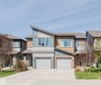 Contemporary townhome exterior featuring an asymmetrical roofline and a combination of horizontal siding textures - 2082 Price Landing, Edmonton, AB  - Outdoor With Facade 