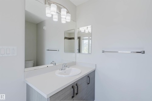 Contemporary vanity with a white countertop and integrated sink - 2082 Price Landing, Edmonton, AB - Indoor Photo Showing Bathroom