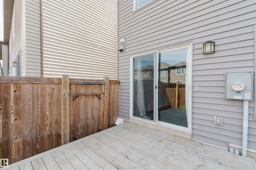 Wood-finish deck offering direct access via sliding glass doors - 2082 Price Landing, Edmonton, AB - Outdoor With Deck Patio Veranda With Exterior