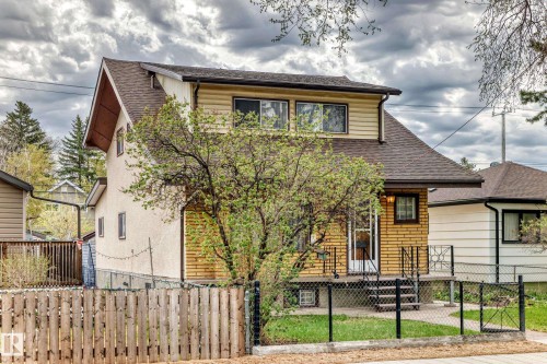 Two-story residence featuring a combination of horizontal siding and brick veneer - 11929 91 Street, Edmonton, AB 