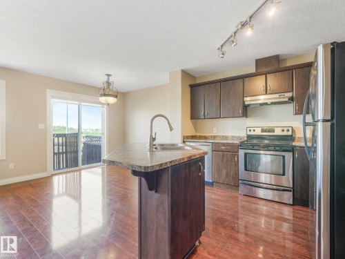 86 Meridian Loop Nw, Stony Plain, AB - Indoor Photo Showing Kitchen With Double Sink