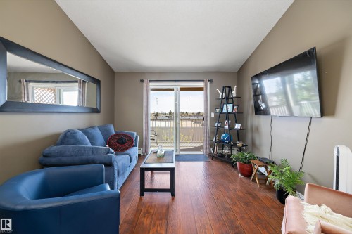 Bright living room with look on the south facing balcony - 415 12550 140 Avenue, Edmonton, AB - Indoor Photo Showing Living Room