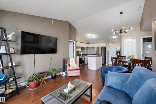 Bright living room with look on the south facing balcony - 415 12550 140 Avenue, Edmonton, AB - Indoor Photo Showing Living Room