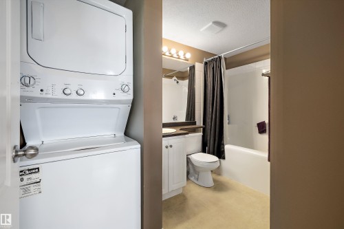 Laundry room and full 4 piece bathroom - 415 12550 140 Avenue, Edmonton, AB - Indoor Photo Showing Laundry Room