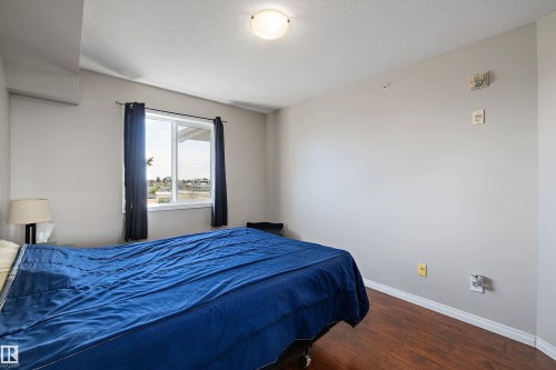 Secondary bedroom with lots of natural light and neutral paint colours - 415 12550 140 Avenue, Edmonton, AB - Indoor Photo Showing Bedroom