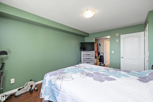 Primary bedroom with lots of natural light with an ensuite and walk in closet - 415 12550 140 Avenue, Edmonton, AB - Indoor Photo Showing Bedroom