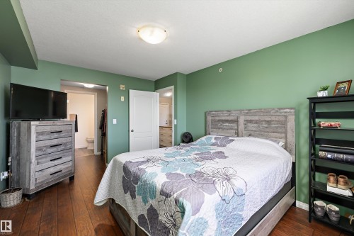Primary bedroom with lots of natural light with an ensuite and walk in closet - 415 12550 140 Avenue, Edmonton, AB - Indoor Photo Showing Bedroom
