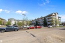 View from the parking lot of the apartment complex. Includes plenty of visitor parking and surface stalls as well as underground stalls for the owners - 415 12550 140 Avenue, Edmonton, AB  - Outdoor With Balcony 