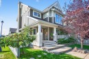 Contemporary siding exterior with a welcoming covered front porch, white railing, and concrete steps - 8003 Summerside Grande Boulevard, Edmonton, AB  - Outdoor With Deck Patio Veranda 
