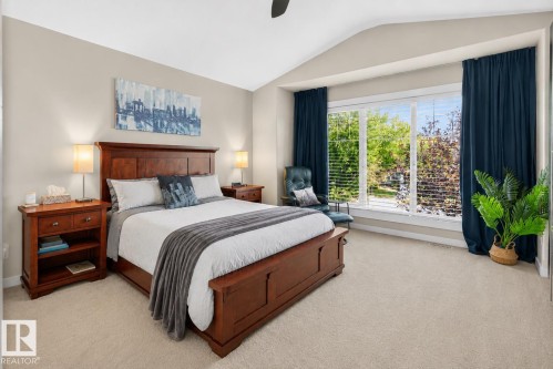 Vaulted ceilings complement light-toned walls and plush carpeting in this spacious bedroom - 8003 Summerside Grande Boulevard, Edmonton, AB - Indoor Photo Showing Bedroom