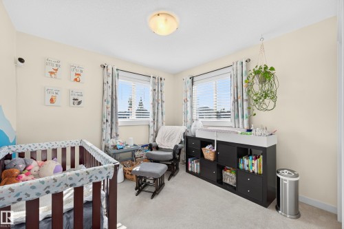Room featuring light-colored walls and soft carpeting - 8003 Summerside Grande Boulevard, Edmonton, AB - Indoor Photo Showing Bedroom