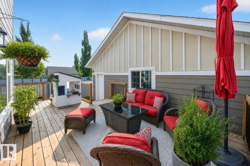 Spacious outdoor deck featuring natural wood planks and a partial privacy wall - 8003 Summerside Grande Boulevard, Edmonton, AB - Outdoor With Deck Patio Veranda With Exterior