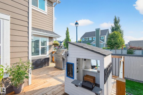Expansive wood deck with a built-in storage bench and privacy fencing - 8003 Summerside Grande Boulevard, Edmonton, AB - Outdoor With Deck Patio Veranda With Exterior