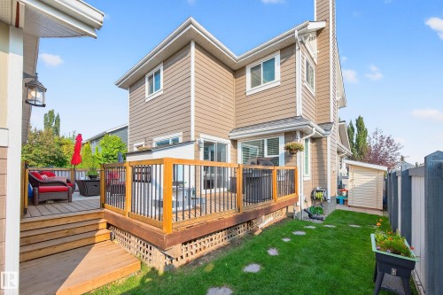 Multi-level wood deck featuring black metal railings - 8003 Summerside Grande Boulevard, Edmonton, AB - Outdoor With Deck Patio Veranda With Exterior