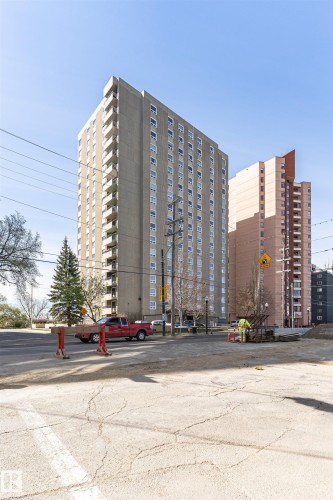 Multi-story building featuring numerous balconies and a concrete facade - 1806 12303 Jasper Avenue, Edmonton, AB - Outdoor With Facade