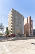 Multi-story building featuring numerous balconies and a concrete facade - 