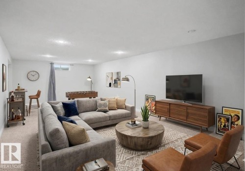 Spacious room featuring light-toned carpeting and recessed lighting - 16715 79A Avenue, Edmonton, AB - Indoor Photo Showing Living Room
