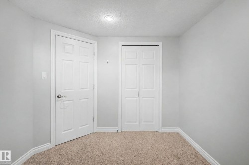 Neutral-toned wall finish with light brown carpet flooring - 16715 79A Avenue, Edmonton, AB - Indoor Photo Showing Other Room