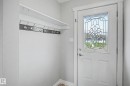 Entryway featuring a white door with decorative leaded glass, white trim, and light gray walls - 16715 79A Avenue, Edmonton, AB  - Indoor Photo Showing Other Room 