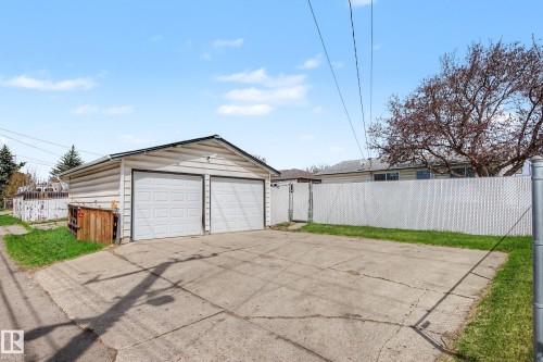 Two-car detached garage with panel doors and a concrete driveway - 16715 79A Avenue, Edmonton, AB - Outdoor