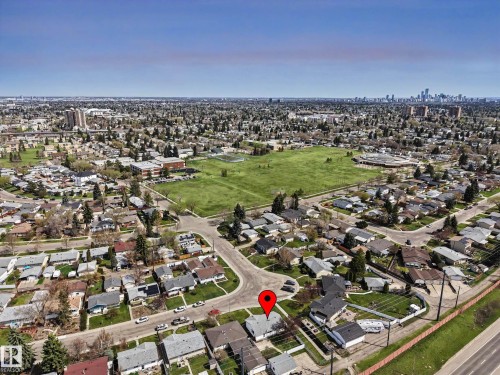 Aerial perspective showcasing a residential neighborhood with a distant cityscape - 16715 79A Avenue, Edmonton, AB - Outdoor With View