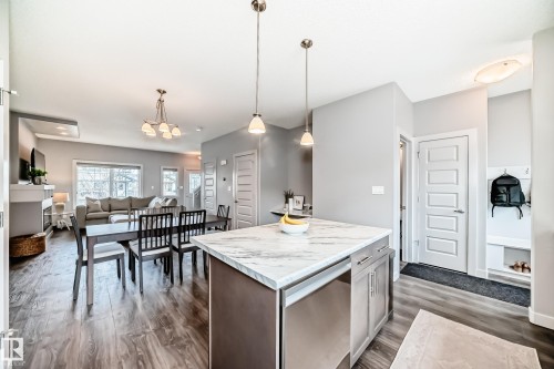 Central kitchen island and pendant lighting - 6919 Cardinal Wynd, Edmonton, AB - Indoor