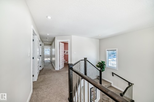 Upper-level hallway featuring recessed lighting, light gray wall paint, and a carpeted floor - 3716 46 Avenue, Beaumont, AB - Indoor Photo Showing Other Room