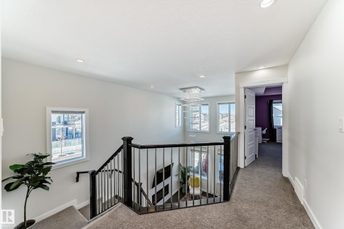 Upper-level landing featuring carpet flooring, crisp white walls, and recessed lighting - 3716 46 Avenue, Beaumont, AB - Indoor Photo Showing Other Room