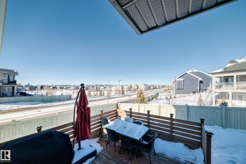 Private wood-deck with slatted privacy fencing, offering an open-sky exposure and extending to a light-toned wooden fence - 3716 46 Avenue, Beaumont, AB - Outdoor