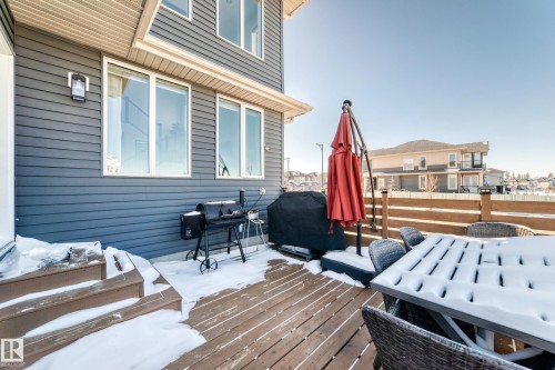 Spacious outdoor deck with wood-finish flooring and a wood railing - 3716 46 Avenue, Beaumont, AB - Outdoor With Deck Patio Veranda With Exterior