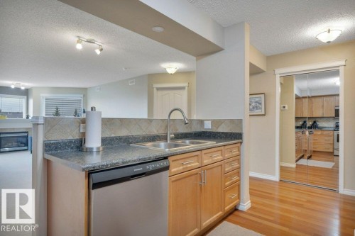 302 102A Bridgeport Crossing, Leduc, AB - Indoor Photo Showing Kitchen With Double Sink