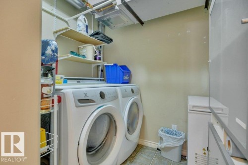 302 102A Bridgeport Crossing, Leduc, AB - Indoor Photo Showing Laundry Room