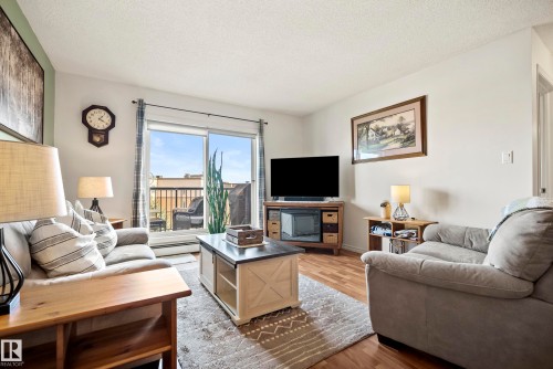 440 2436 Guardian Road, Edmonton, AB - Indoor Photo Showing Living Room