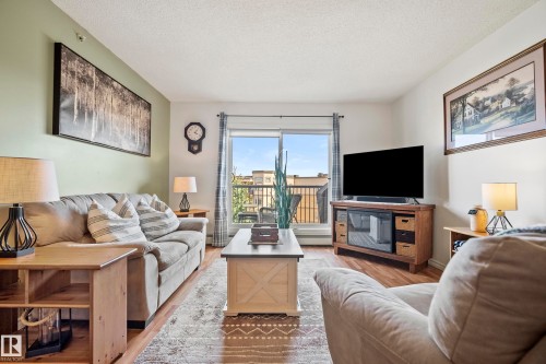 440 2436 Guardian Road, Edmonton, AB - Indoor Photo Showing Living Room