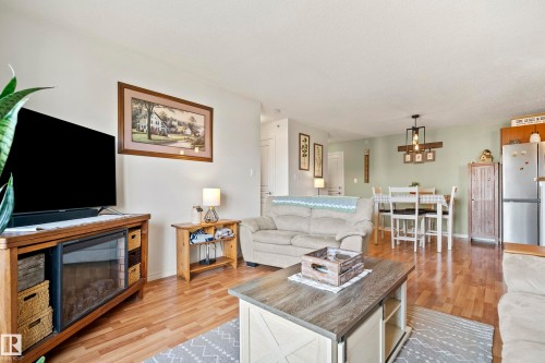 440 2436 Guardian Road, Edmonton, AB - Indoor Photo Showing Living Room