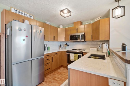 440 2436 Guardian Road, Edmonton, AB - Indoor Photo Showing Kitchen With Upgraded Kitchen