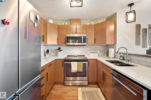 440 2436 Guardian Road, Edmonton, AB - Indoor Photo Showing Kitchen With Double Sink With Upgraded Kitchen