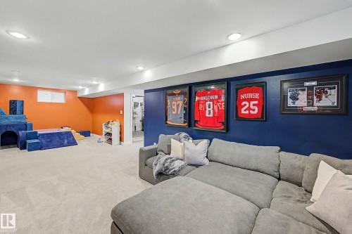 Spacious carpeted room featuring recessed lighting, a window, and two-tone wall paint - 13316 109A Avenue, Edmonton, AB - Indoor Photo Showing Other Room