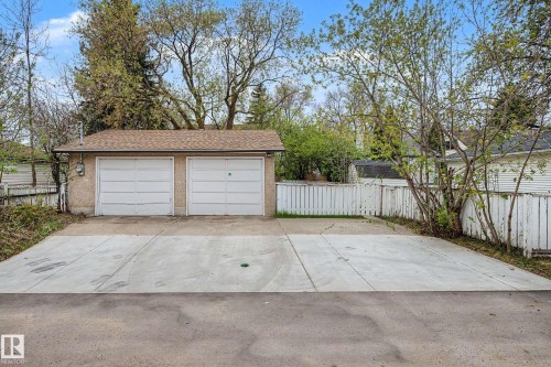 Two-car garage with a stucco finish and a shingled roof - 13316 109A Avenue, Edmonton, AB - Outdoor