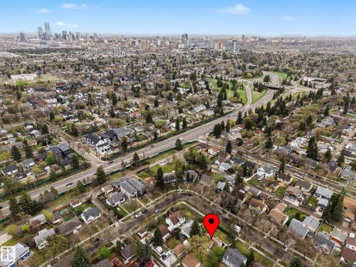 Aerial perspective showcasing the residential neighborhood with a distant cityscape - 13316 109A Avenue, Edmonton, AB - Outdoor With View