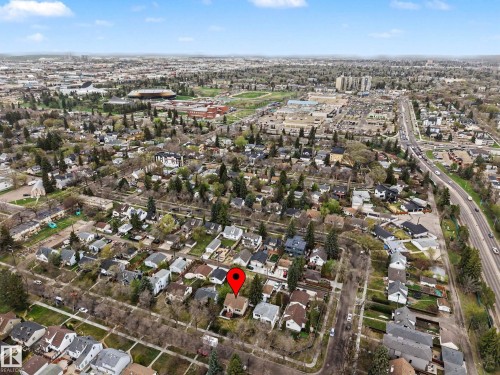 Aerial perspective of a neighborhood featuring residential properties and tree-lined streets - 13316 109A Avenue, Edmonton, AB - Outdoor With View