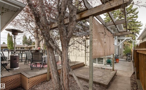 Multi-level wood deck featuring a pergola structure and privacy lattice - 14608 97 Avenue, Edmonton, AB - Outdoor With Deck Patio Veranda With Exterior