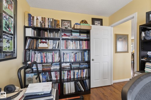 Room featuring wood-finish flooring and a neutral color palette - 77 Lakeshore Drive, Rural Leduc County, AB - Indoor